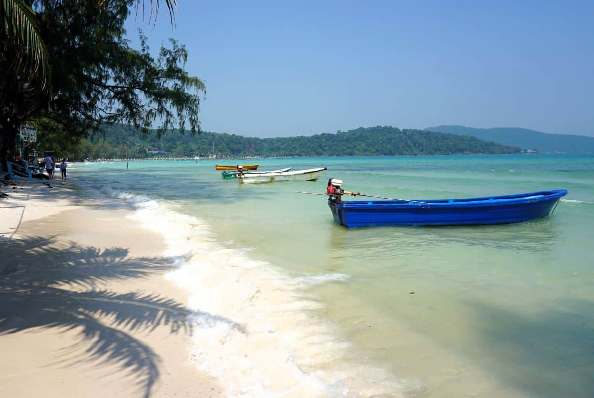Palm trees white sand and turquoise waters of Koh Rong Sanloem island Cambodia