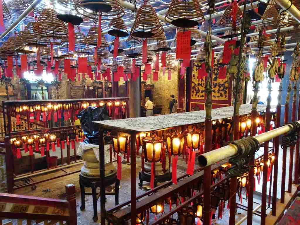 red lanterns and lights inside the Man Mo Taoist Temple in Hong Kong