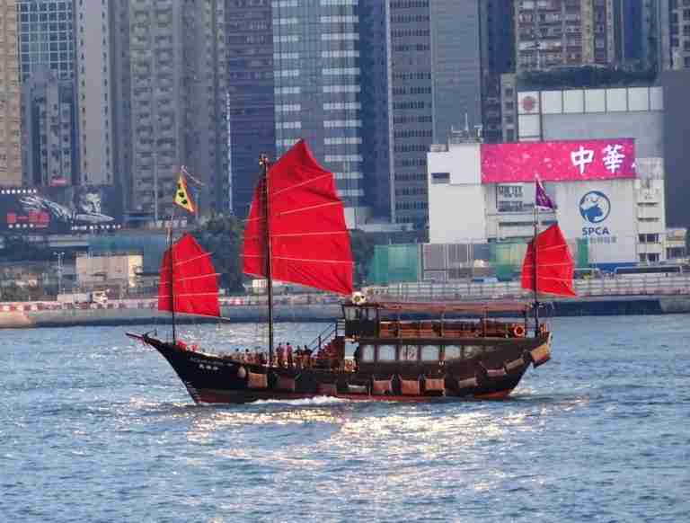 Hong Kong historical landmarks a traditional Chinese junk on Victoria Harbour