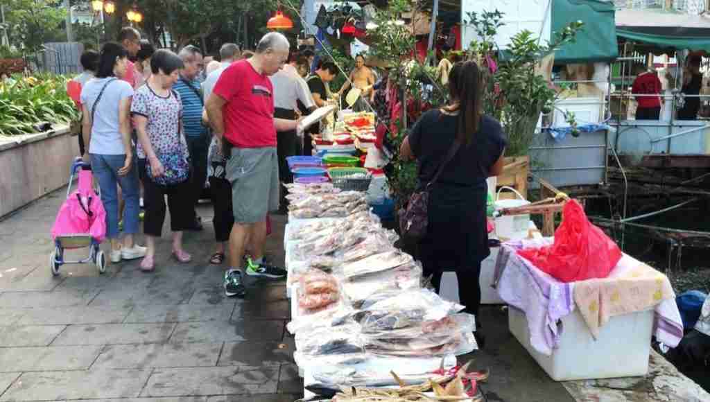people shopping at the Aberdeen Fish Market in Hong Kong
