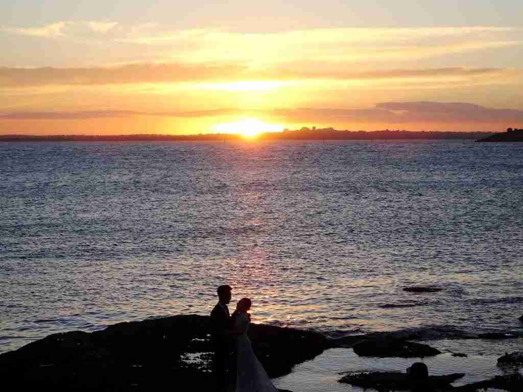 a couple posing for photos at La Perouse in Sydney