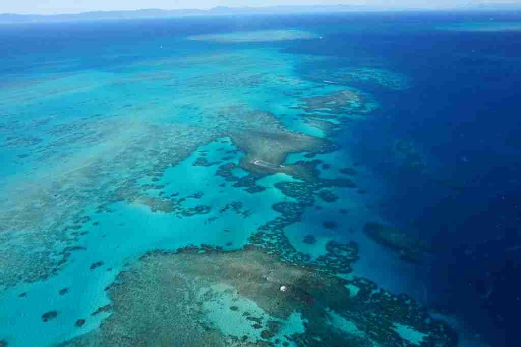 The Great Barrier Reef from the air with aqua and bright blue water