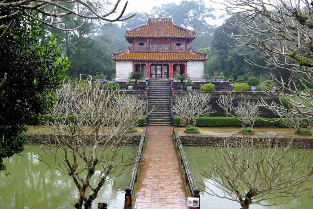 pathway through a lake at the royal tomb in Hue Vietnam