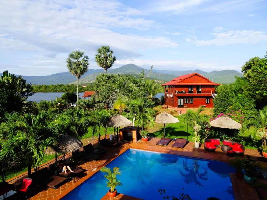 pool, lush green garden and river views at Vill Vedici in Kampot