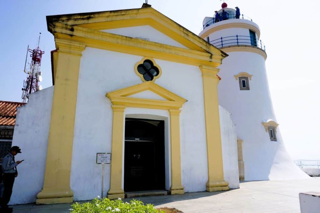 White and yellow chapel and lighthouse on Guia Hill Macau