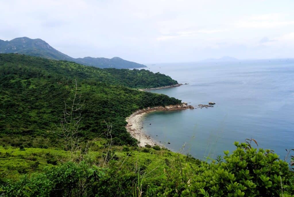 sweeping coastal views of lush green mountains, beaches and ocean Lamma Island Hong Kong