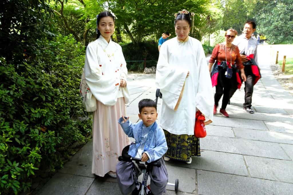 two women and a child wearing Chinese traditional dress at Westlake in Hangzhou