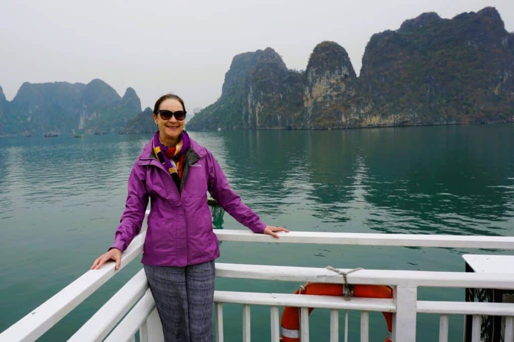 On a Ha Long Bay cruise with karst mountains in the background