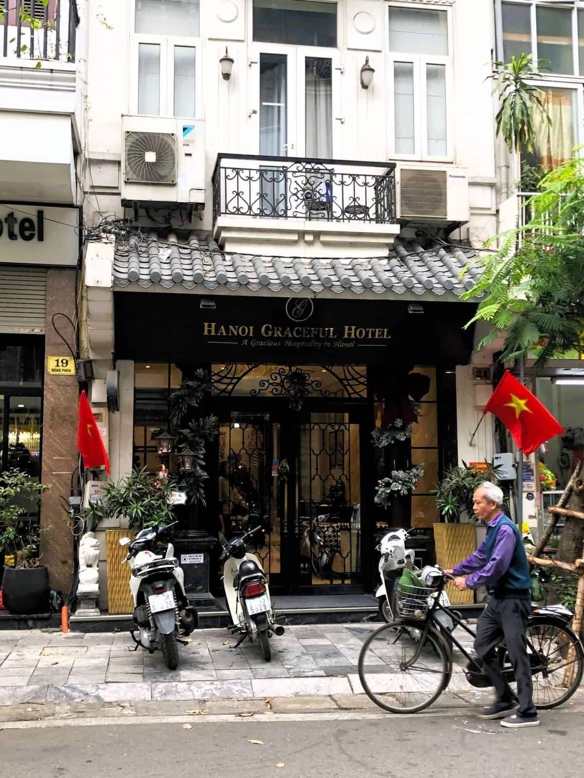 man riding a bicycle in the Hanoi Old Quarter