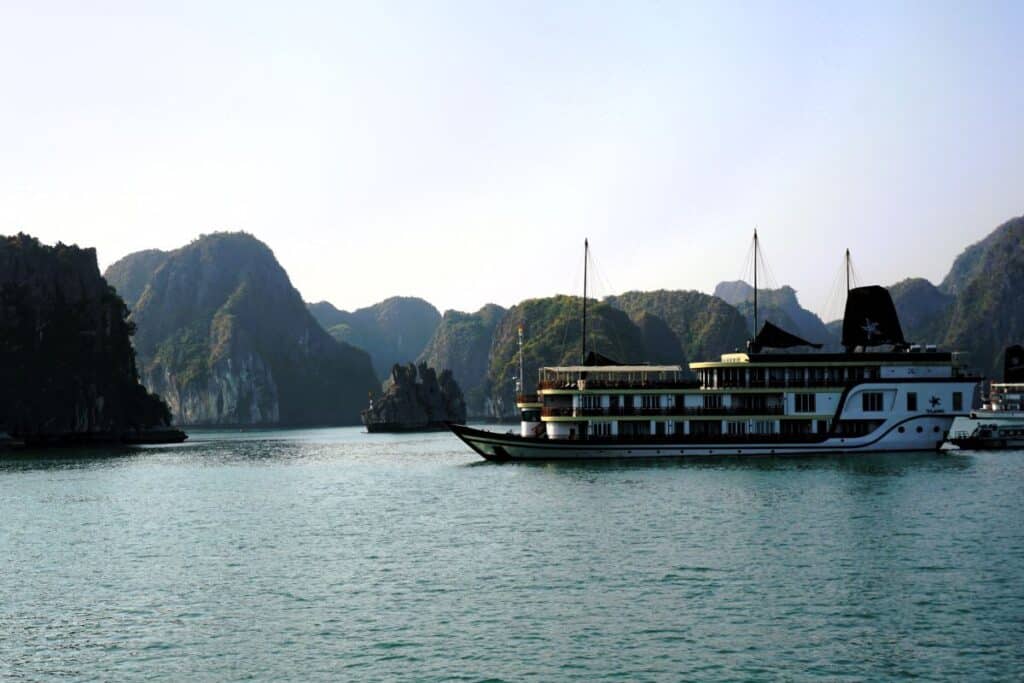 Cruise boat and distant mountains on Cat Ba Island Vietnam