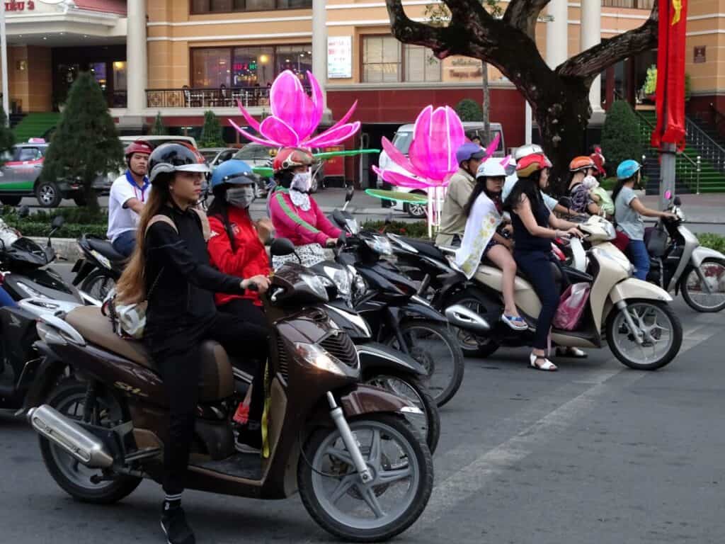 people riding scooters in Vietnam