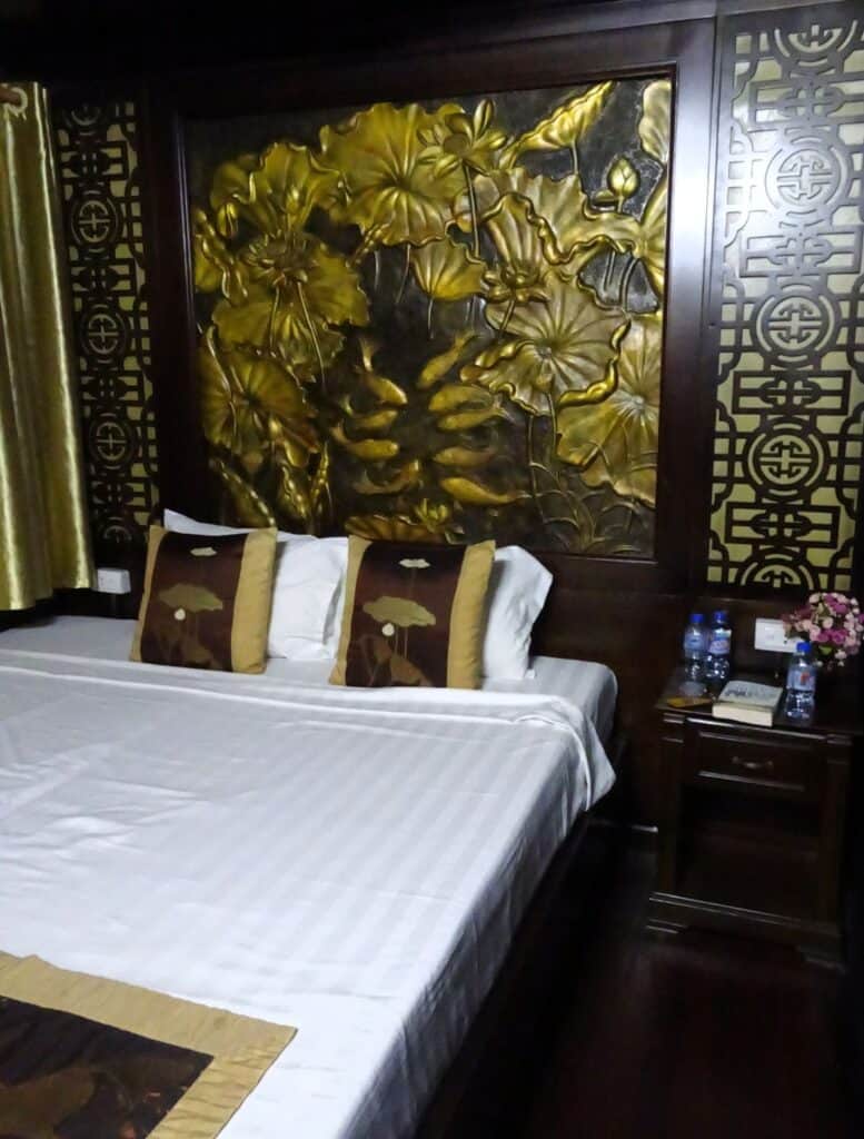 bed with traditional vietnamese carved wooden bed head