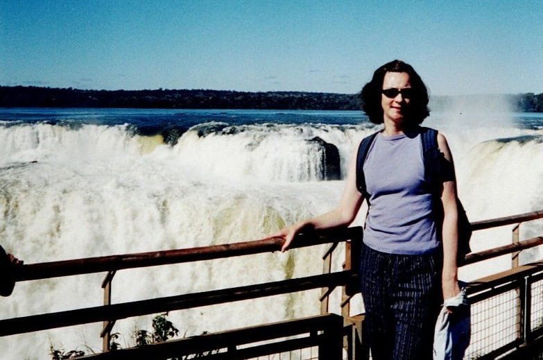 Linda standing in front of Iguazu Falls "The Devils Throat"